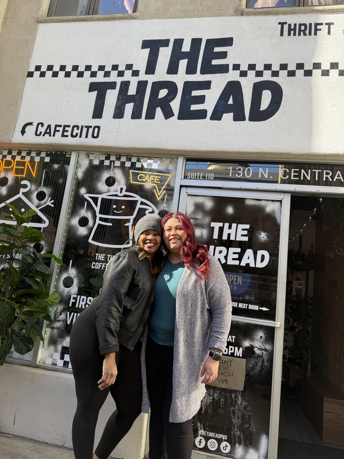 Two women posing in front of The Thread PHX storefront